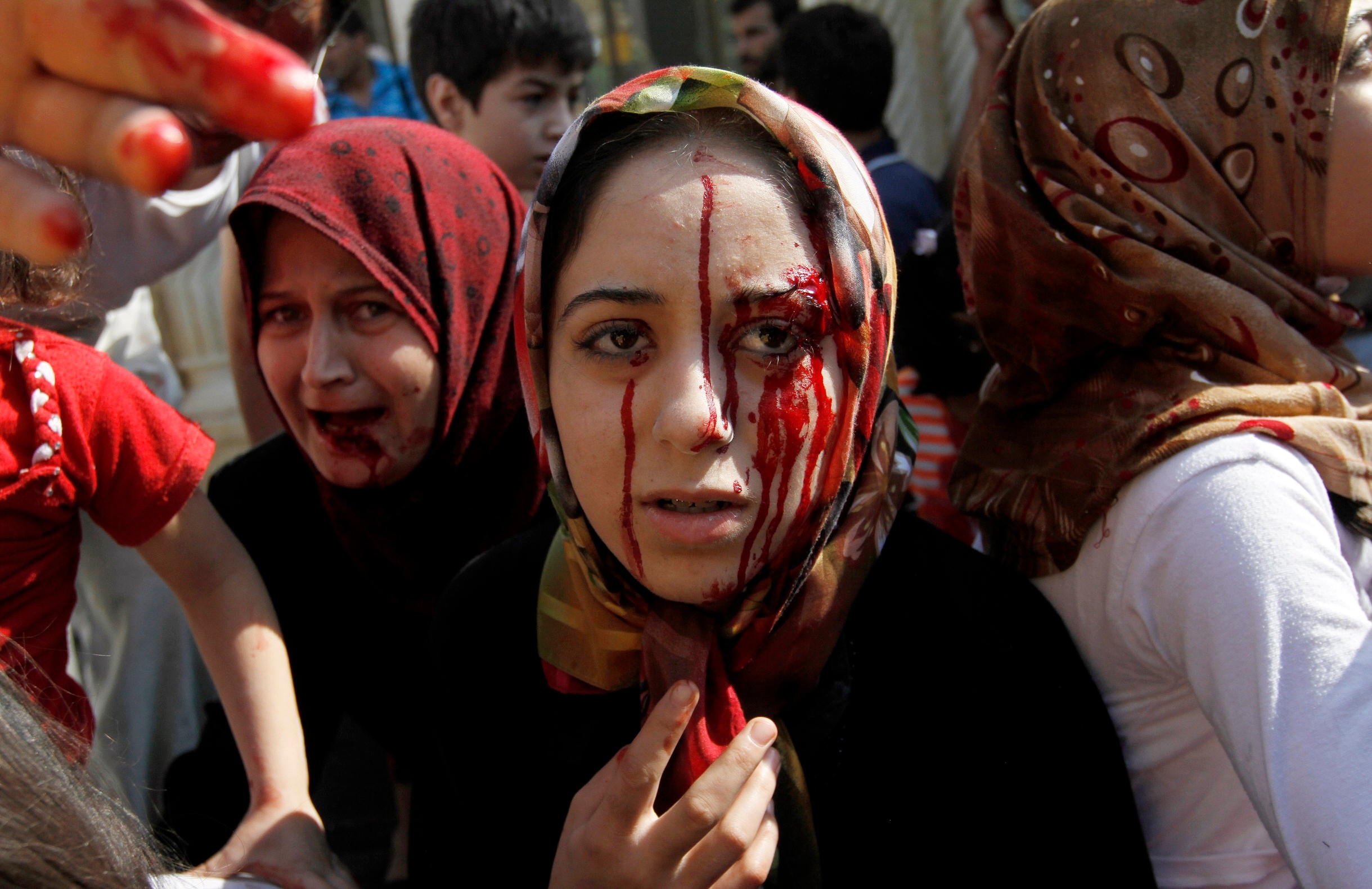FILE - In this Wednesday, Aug. 15, 2012 file photo, Injured Syrian women arrive at a field hospital after an air strike hit their homes in the town of Azaz on the outskirts of Aleppo, Syria. Syrias uprising was not destined to be quick. Instead, the largely peaceful protest movement that spread across the nation slowly turned into an armed insurgency and eventually a full-blown civil war. More than 130,000 people have been killed, and more than 2 million more have fled the country. Nearly three years after the crisis began, Syria