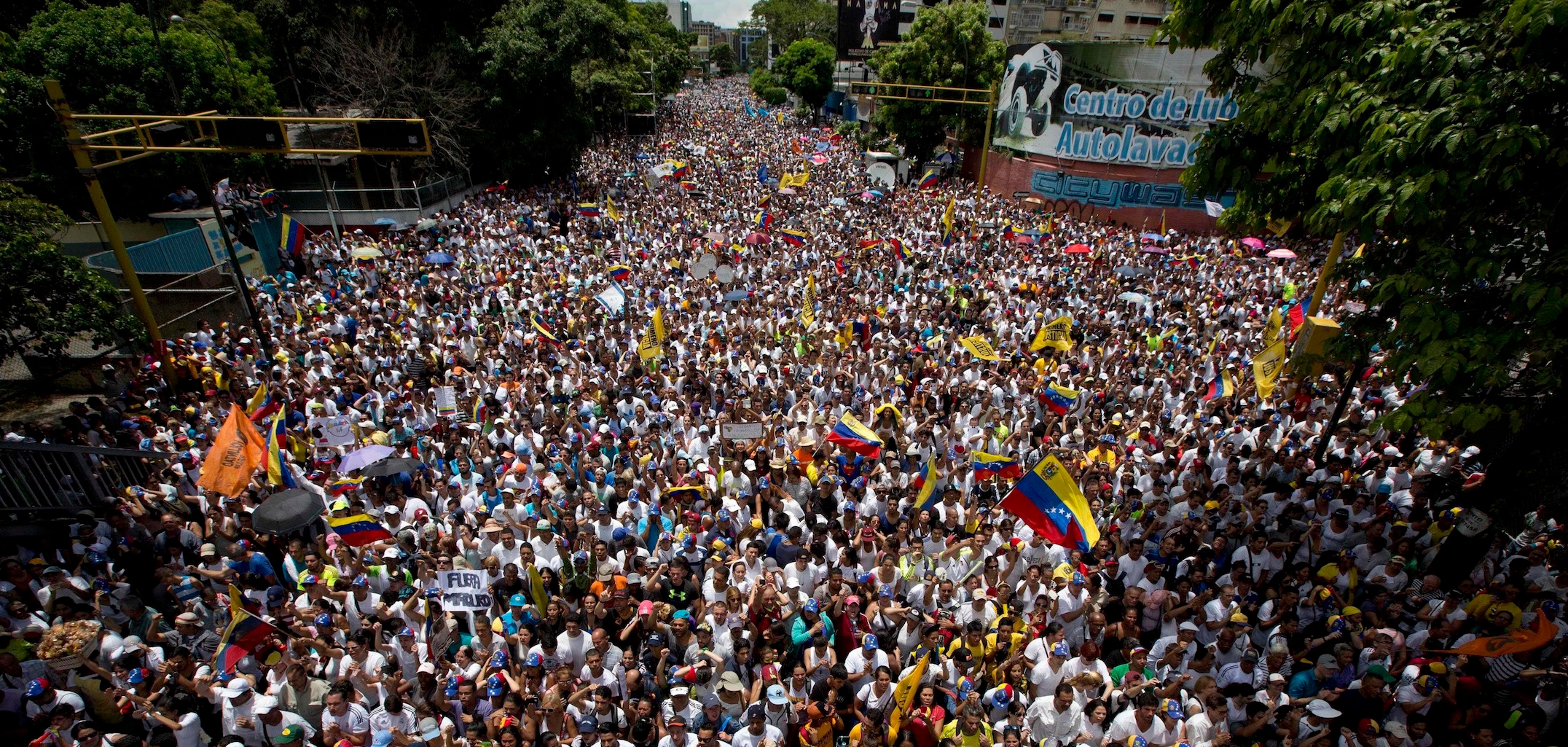 In this Sept 1, 2016 photo, demonstrators take part in the "taking of Caracas" march in Caracas. Venezuela