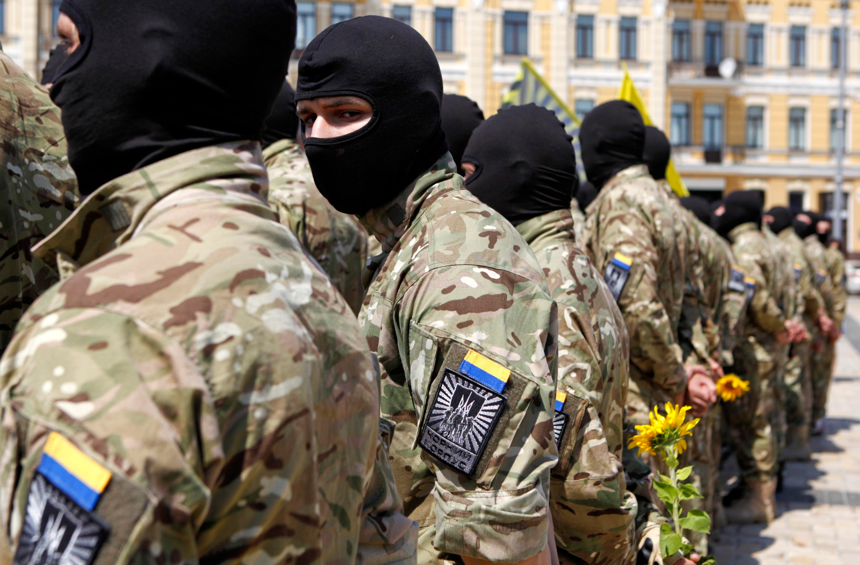 New volunteers of Ukrainian self-defence battalion "Azov" stand at attention in Kiev