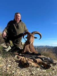 Vasily Shestakov posing with a dead animal in Spain