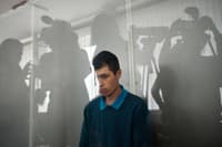 Mikhail Kulikov, a Russian soldier sentenced to 10 years in jail after he was found guilty of firing a tank at a multi-storey apartment building in the first days of the Ukraine war, at the court in Chernihiv on Aug. 4. He was the second Russian soldier convicted in Ukraine since the beginning of the invasion. 