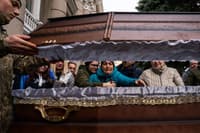Family of Ukrainian soldier Ivan Lipskiy grieve at his casket during a military service of 5 Ukrainian soldiers in Odessa, Ukraine, on March 29. Lipskiy was killed on March 18 during a Russian airstrike that hit the 36th Ukrainian Naval Infantry Brigade killing more than 40 Ukrainian soldiers in the city of Mykolaiv.