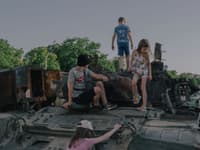 Children play on destroyed Russian war equipment in front of St. Michael‘s Monastery in Kyiv, Ukraine, on June 12.