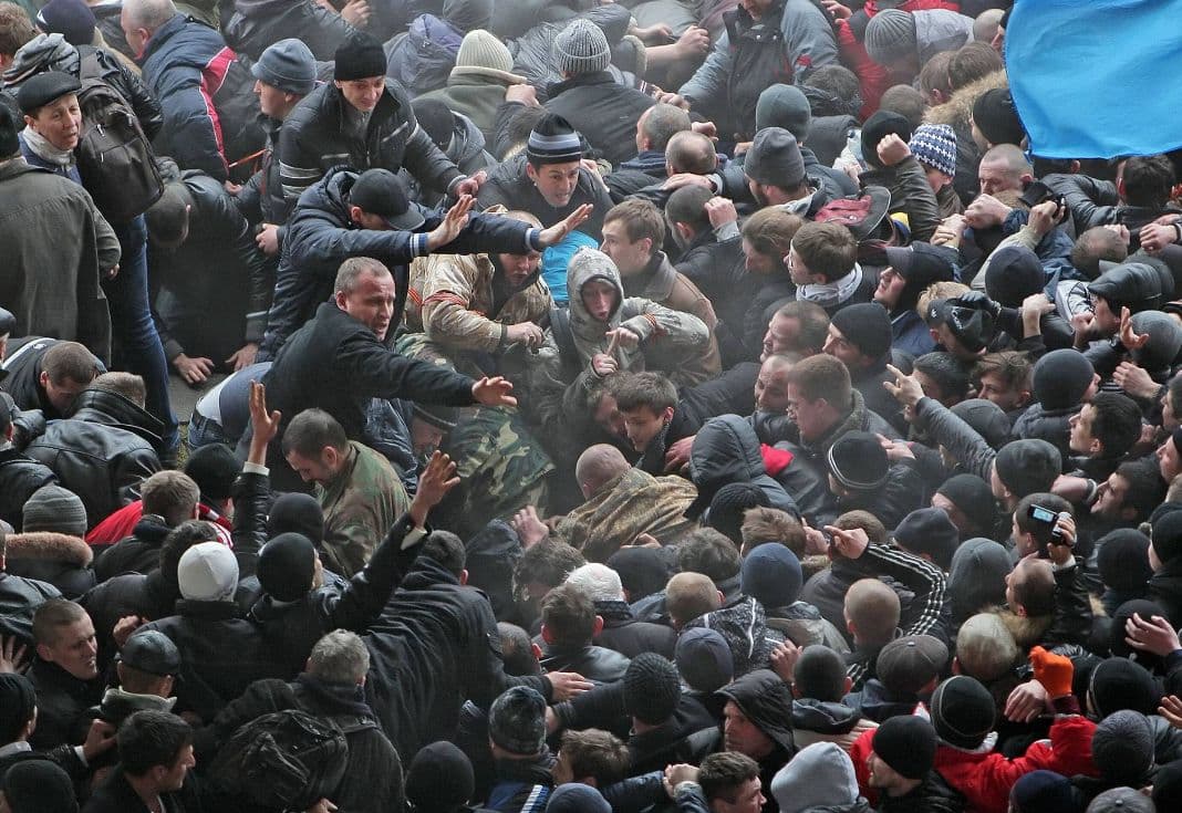 The confrontation between supporters of Ukrainian unity and pro-Russian activists outside the Crimean Supreme Council building in Simferopol, Ukraine, on February 26, 2014.  