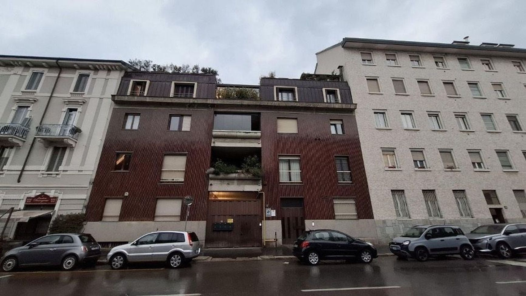 The building in Milan where Denis Norov's apartment is located.