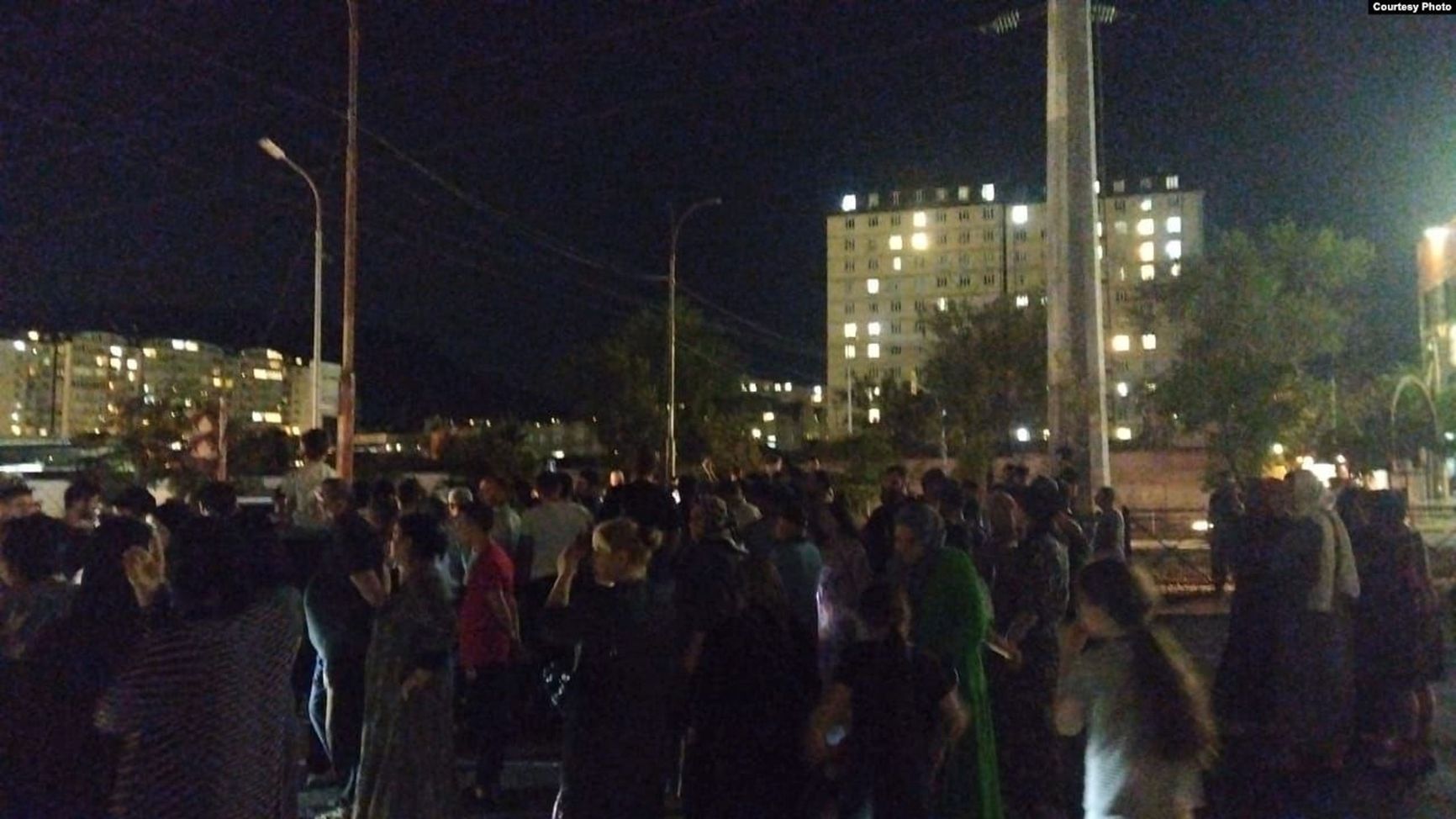 Protesters in a dark Imama Shamilya Avenue