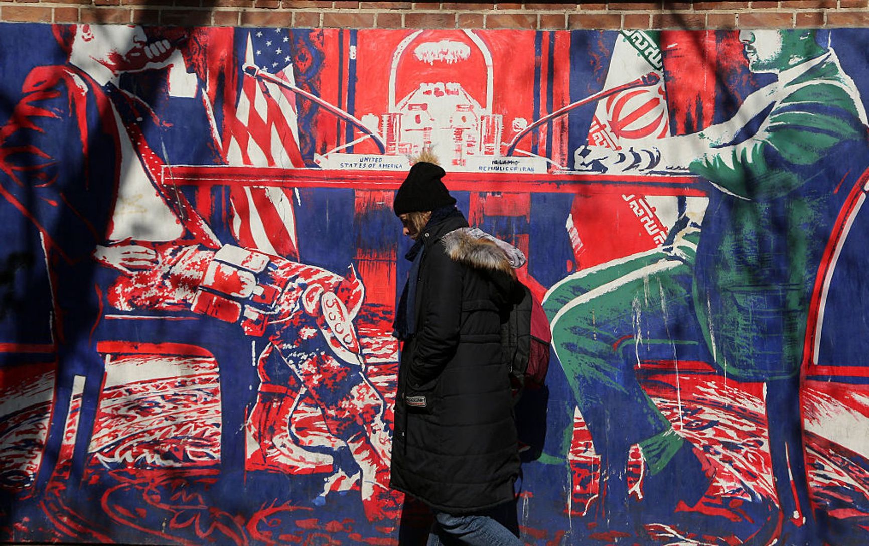 A mural depicting talks between U.S. and Iranian representatives on the wall of the former U.S. embassy in Tehran