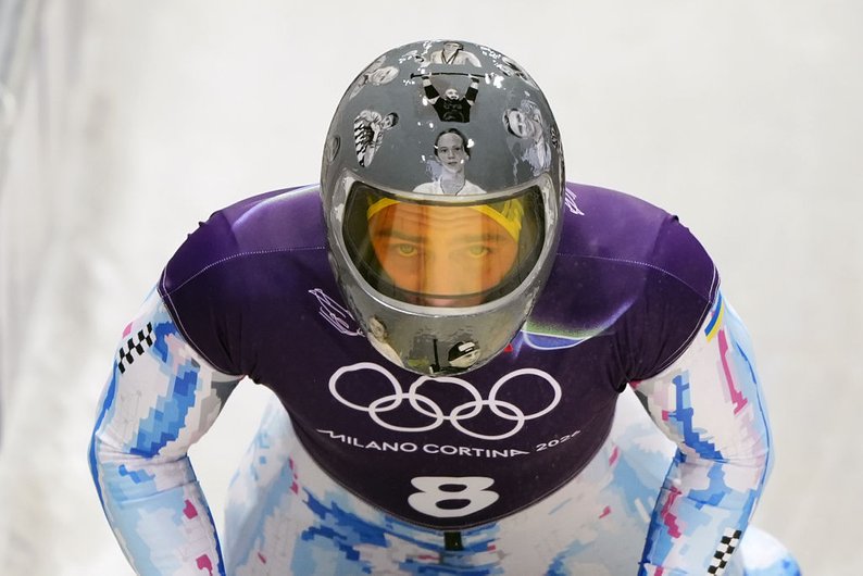 IOC disqualifies Ukrainian skeleton pilot who planned to compete in a helmet decorated with portraits of athletes killed in the war