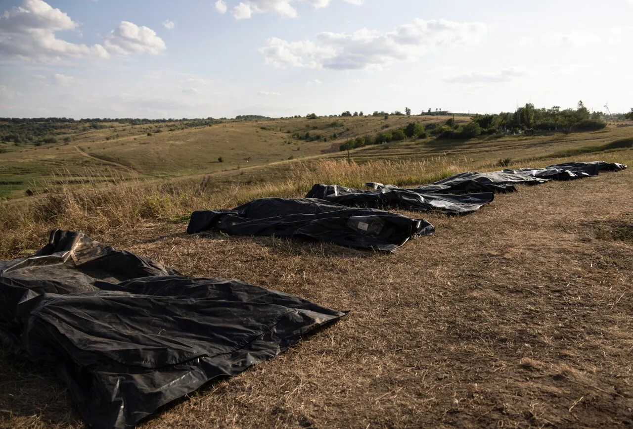 Body bags of fallen soldiers in a field near the front line in the Bakhmut area, Donetsk Region, Ukraine, Aug. 1, 2024. Photo: Nikoletta Stoyanova / EPA / Scanpix / LETA